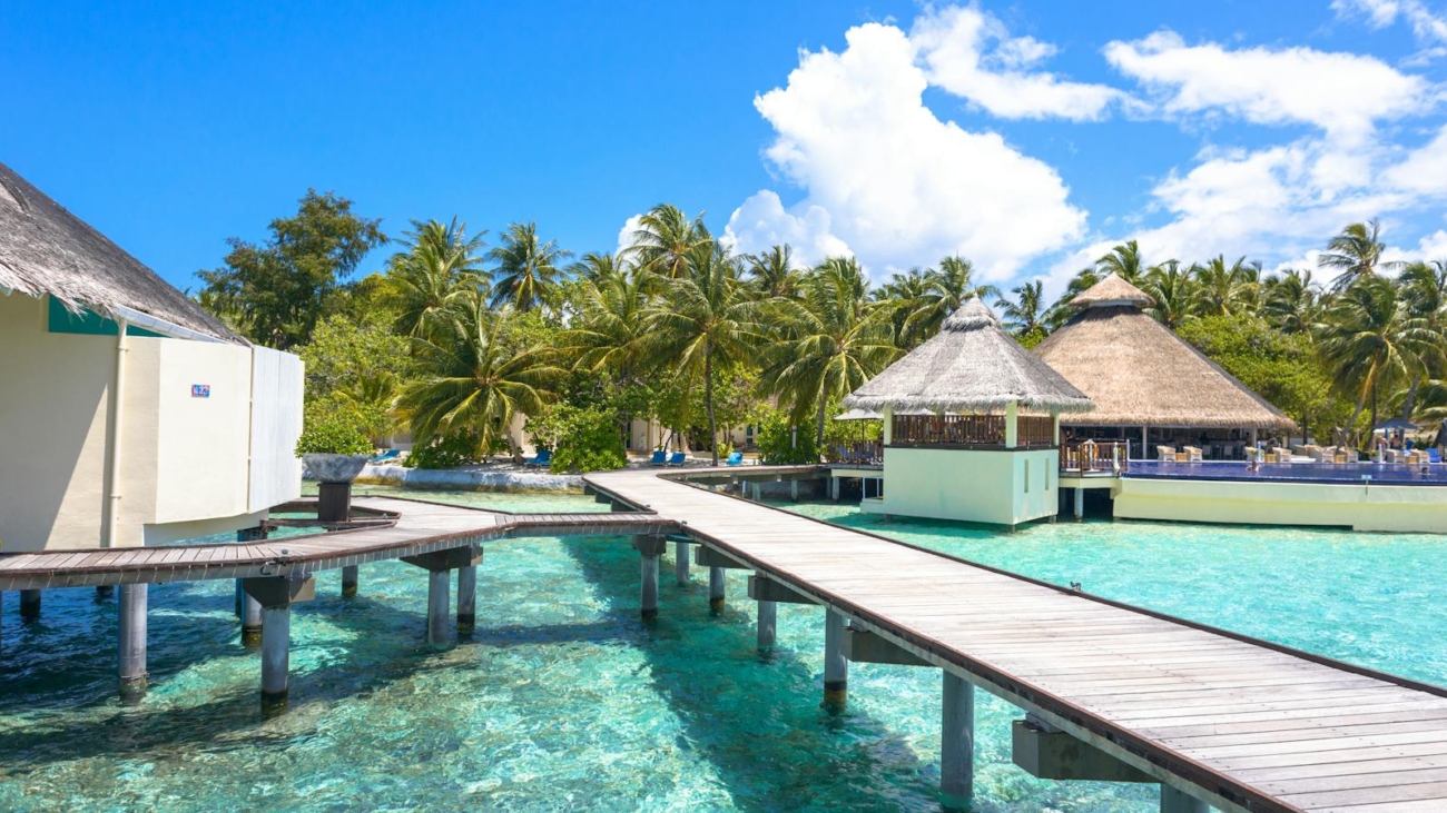 Explore tropical paradise with stunning overwater bungalows and crystal-clear waters in the Maldives.