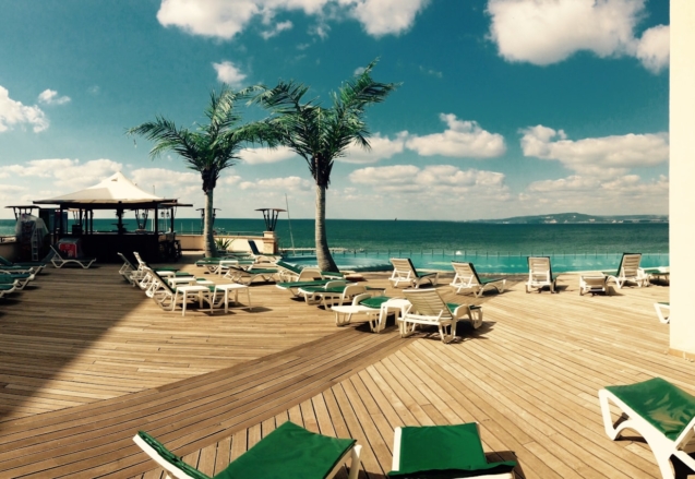 green loungers on dock at daytime