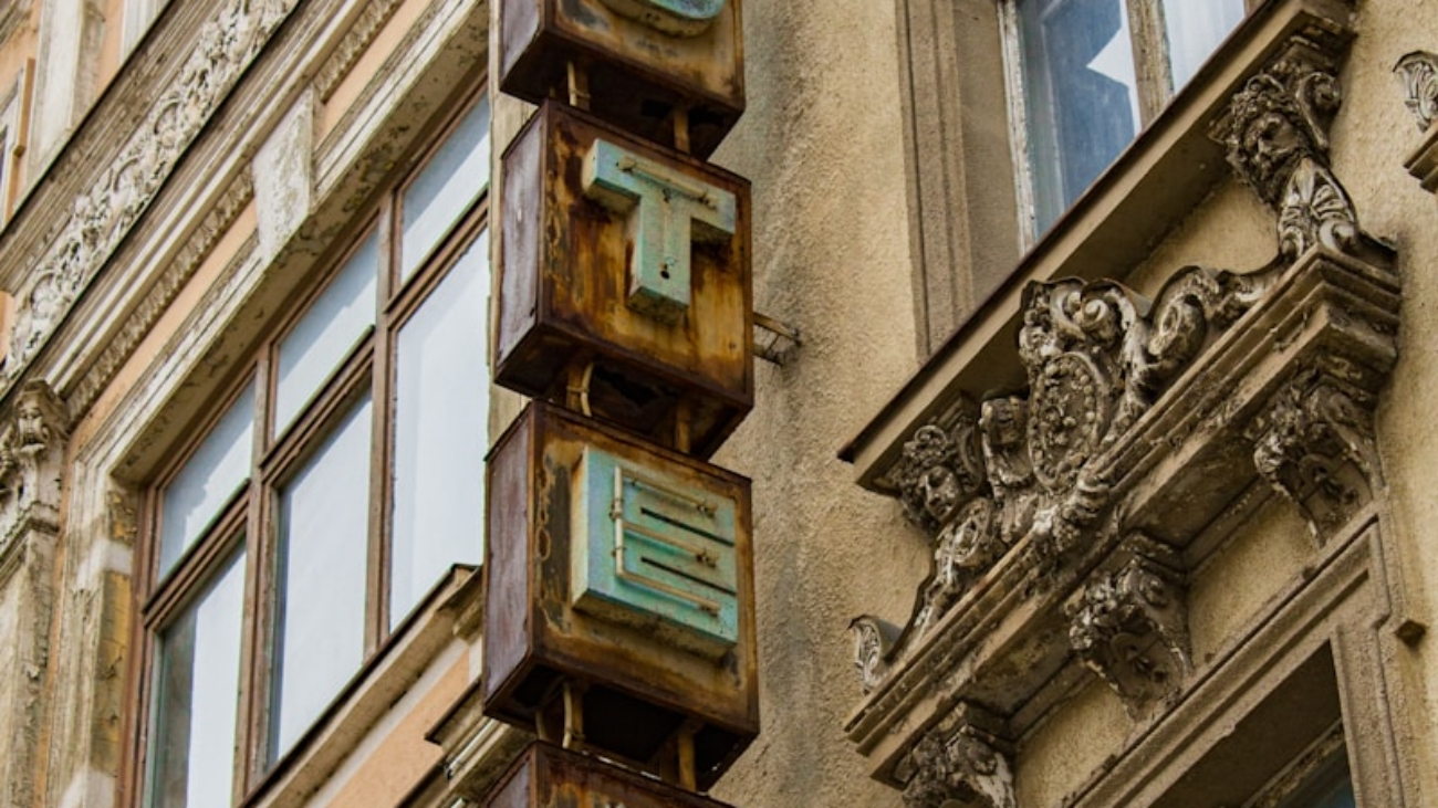 brown concrete building with glass windows