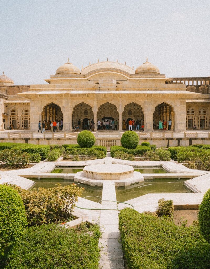 a large building with a fountain in front of it