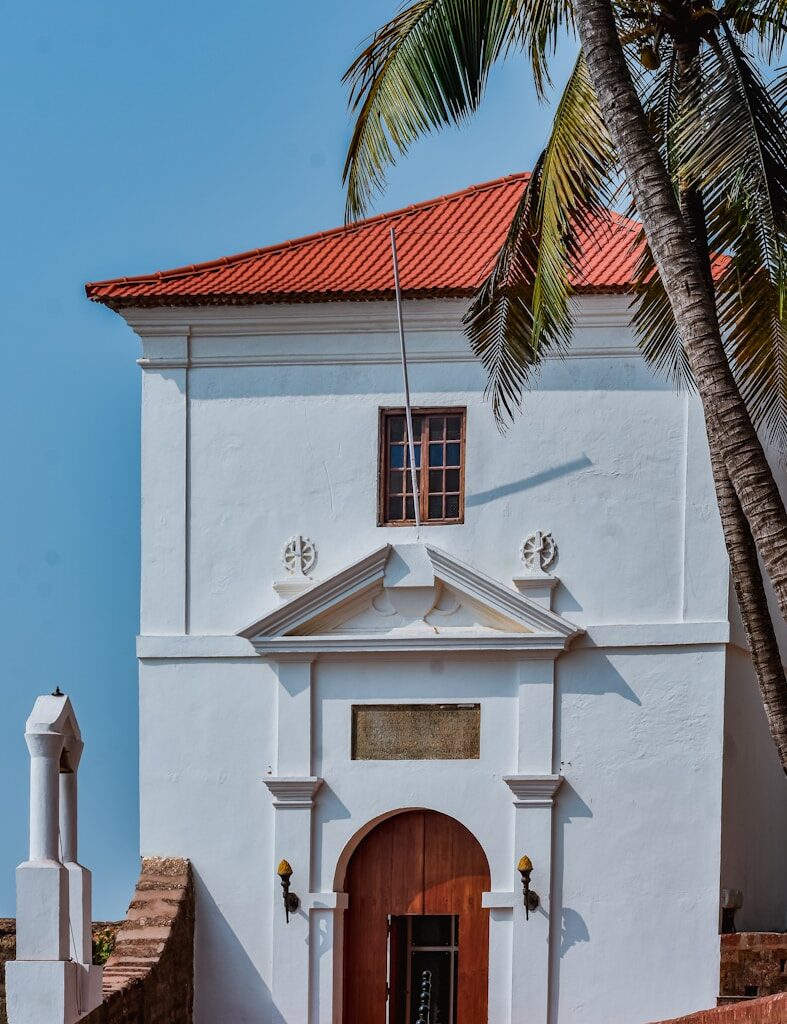 a white building with a red roof