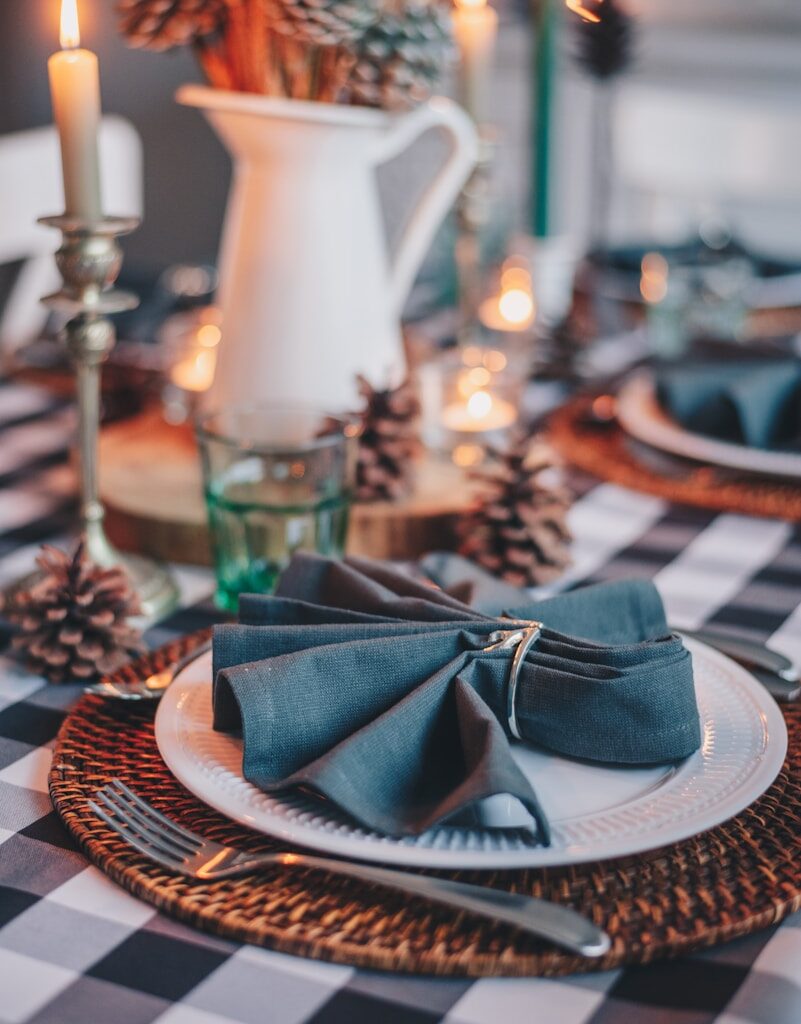 blue and white hat on brown woven round table