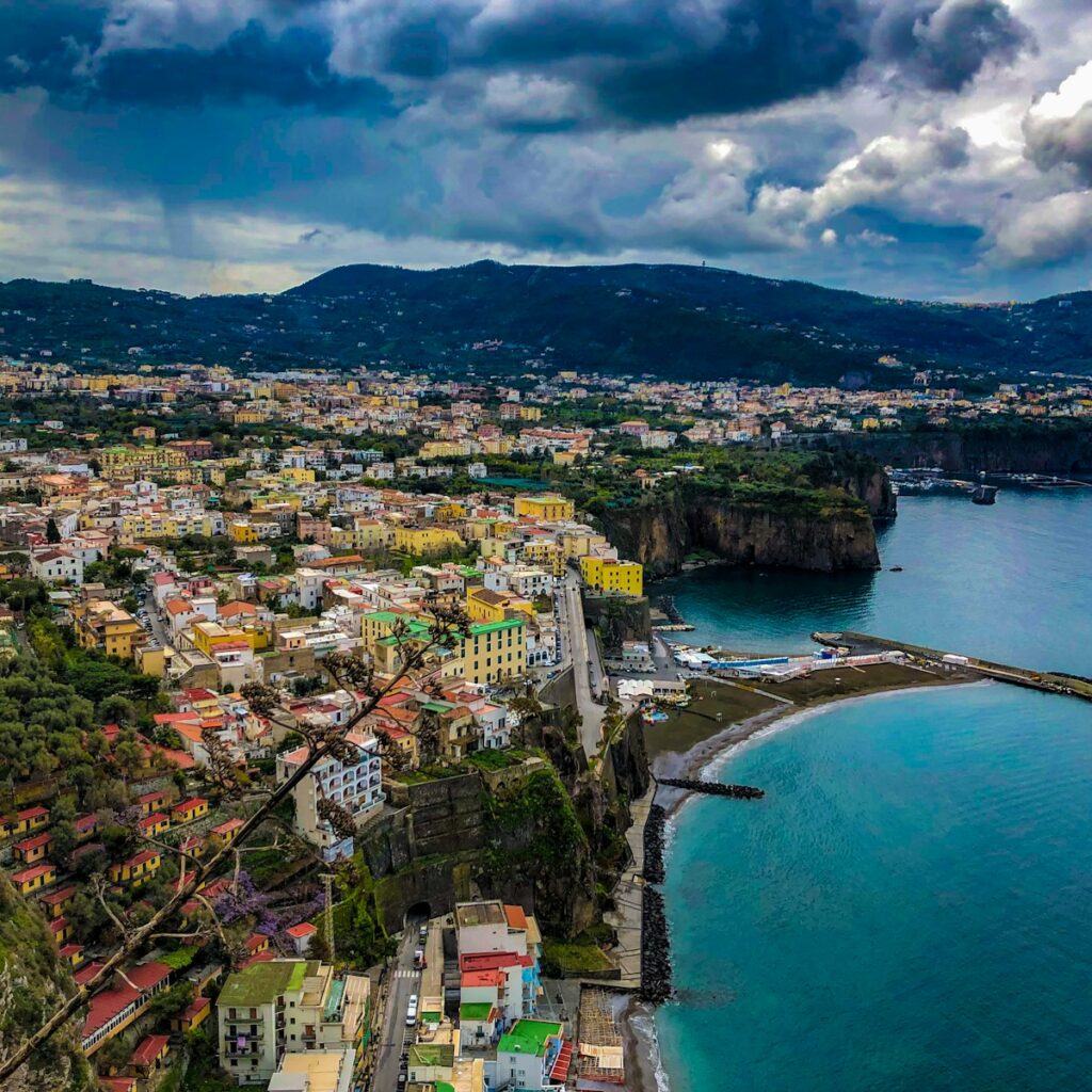 aerial photography of buildings beside seashore during daytime