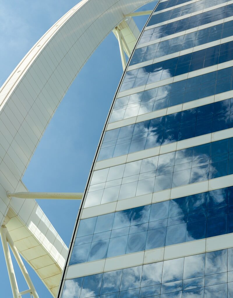 white and blue glass walled building