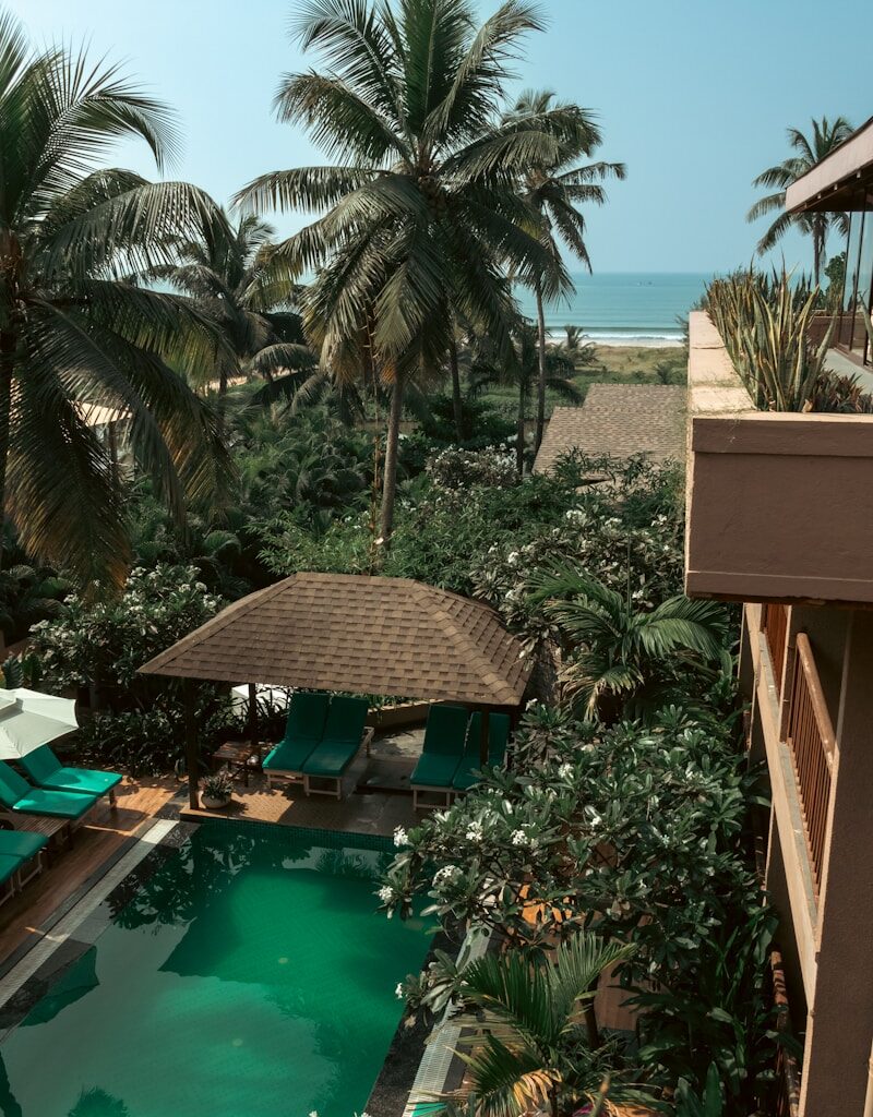 a view of a pool from a hotel room