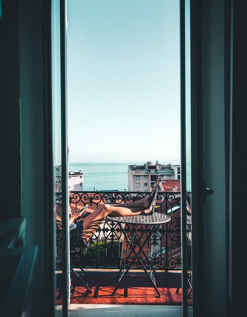 person sitting on balcony