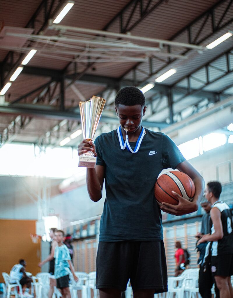 a person holding a basketball