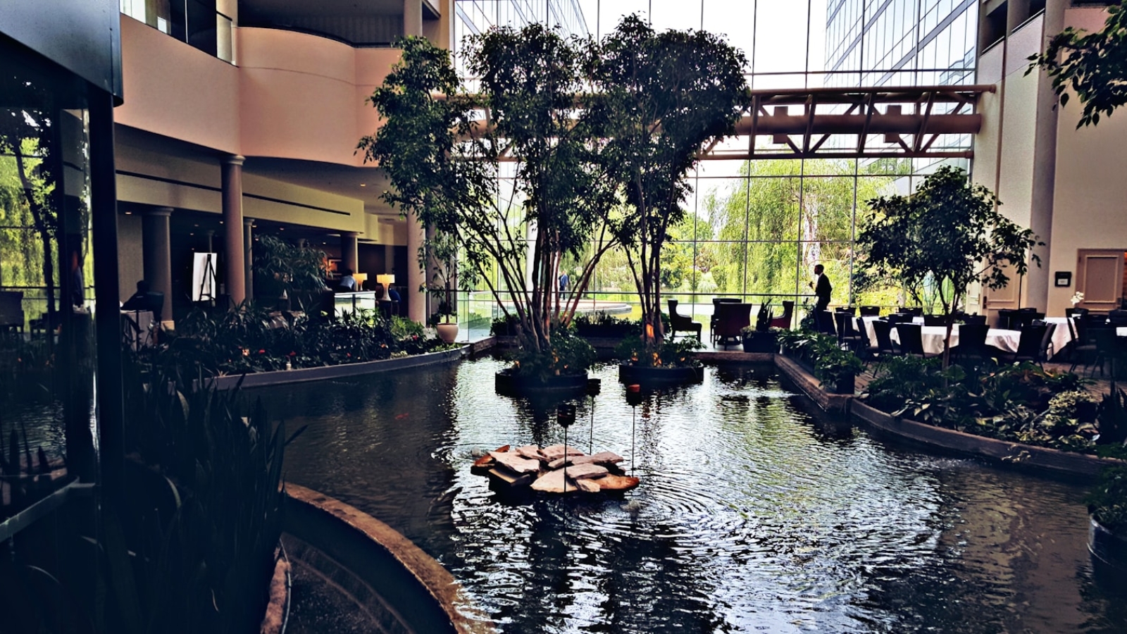 a small boat is in the middle of a pond