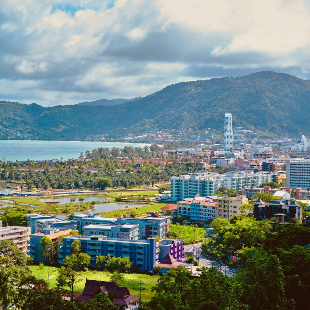 a view of a city with mountains in the background