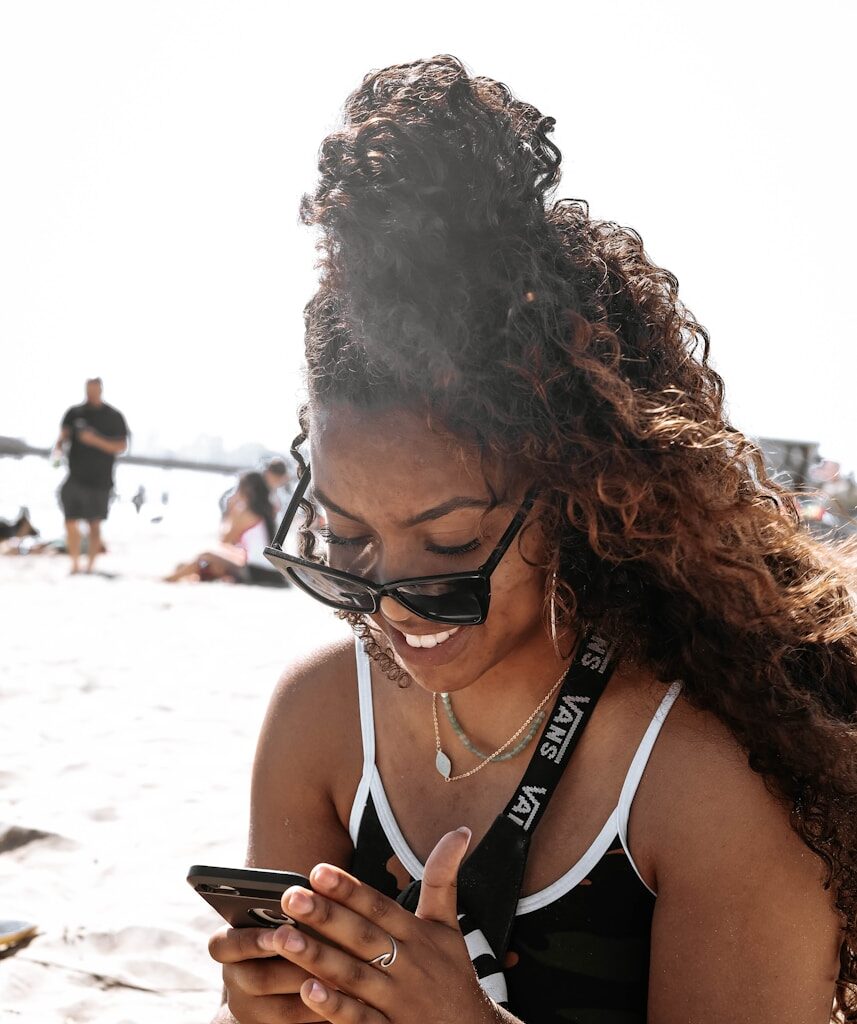 woman in black tank top wearing black framed eyeglasses