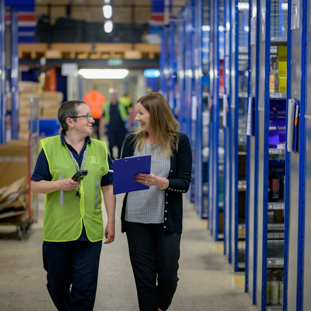 a man and a woman in a warehouse